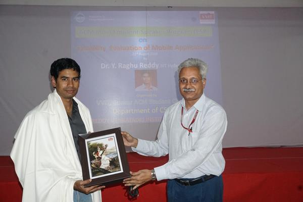 Dr.Ravela Naveen felicitating Dr.Y.Raghu Reddy